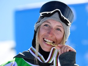 Gold medal winner Laurie Blouin celebrates on the podium after the women's slopestyle final at the world snowboard and freestyle ski world championships in Sierra Nevada, Spain, on March 11, 2017.
