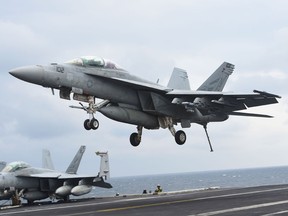 A two-seater F/A-18F Super Hornet landing on the deck of the Nimitz-class aircraft carrier USS Carl Vinson during a South Korea-US joint military exercise in seas east of the Korean Peninsula March 14, 2017.