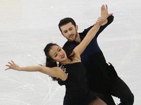 In this Feb. 16, 2017, photo, Yura Min and Alexander Gamelin perform in the short dance at the ISU Four Continents Figure Skating Championships in Gangneung, South Korea.