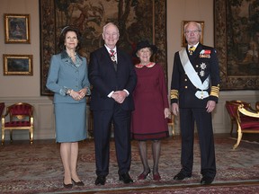 Sweden's Queen Silvia, left, Governor-General David Johnson, second left,  his wife Sharon Johnson and King Carl XVI Gustaf pose for the cameras at Stockholm Royal Palace Monday Feb. 20, 2017.