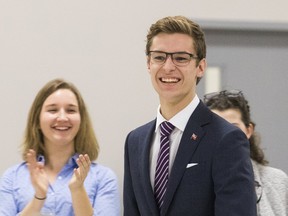 MPP Sam Oosterhoff smiles following the announcement of his Tuesday night win for the Progressive Conservative nomination for the new riding of Niagara Wes