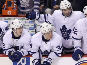 Toronto Maple Leafs players, from left, Mitch Marner, Austin Matthews and Nazem Kadri look on during a shootout against the Vancouver Canucks on Saturday, Dec. 3, 2016.