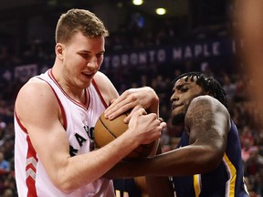 Toronto Raptors centre Jakob Poeltl battles for the ball with Indiana Pacers forward Rakeem Christmas at the Air Canada Centre on Sunday, March 19, 2017.