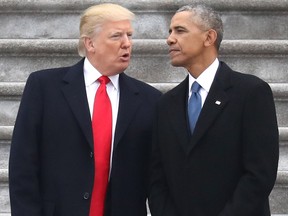 President Donald Trump and former president Barack Obama exchange words at the  U.S. Capitol  on January 20, 2017 in Washington, DC