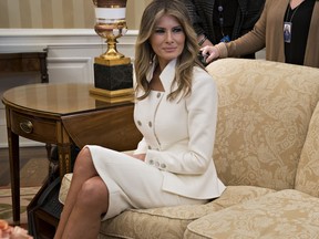 U.S. First Lady Melania Trump sits in the Oval Office of the White House on Feb. 15. She  intends to spend little time in Washington, choosing to live in New York with the couple's 10-year-old son