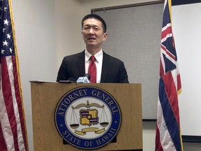 In this Feb. 3, 2017, file photo, Hawaii Attorney General Doug Chin speaks at a news conference in Honolulu announcing the state of Hawaii has filed a lawsuit challenging President Donald Trump's travel ban. Hawaii is planning to challenge Trump's revised travel ban, becoming the first state to formally do so on Tuesday.