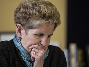 Premier Kathleen Wynne calls Hydro customers on the phone from her Queen's Park officee in Toronto, Ont. on Friday March 3, 2017.