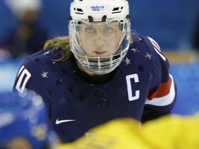 Meghan Duggan and Team USA are set to play in the women's world hockey championship after a settlement with USA Hockey was reached Tuesday over a dispute involving players' wages.
