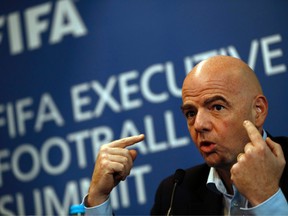 FIFA President Gianni Infantino gestures while talking with journalists during a press conference following the FIFA Executive Football Summit near Heathrow airport in London on March 9, 2017.