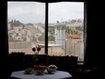 An Israeli security watch tower is seen from one of the rooms of the "The Walled Off Hotel" in the West Bank city of Bethlehem, March 3, 2017.