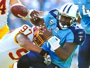Lorenzo Alexander of the Washington Redskins forces a fumble by quarterback Vince Young of the Tennessee Titans during an NFL game on Nov. 21, 2010.