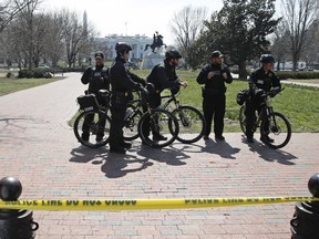 US Secret Service officers stand in the cordoned off Lafayette Park after a security incident near the fence of the White House in Washington, Saturday, March 18, 2017. President Trump was not at the White House at the time of the incident.