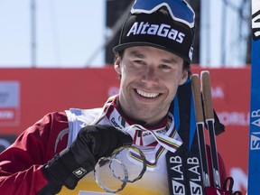 Alex Harvey of St-Ferreol-les-Neiges, Que. hold his medals after he finished third overall in the World Cup standings on March 19.