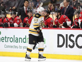 Brad Marchand of the Bruins skates past the Senators bench after his game-winning goal in the third period of their game  at the Canadian Tire Centre in Ottawa on Wednesday night. The Bruins won 2-1 in the opener of their Eastern Conference quarter-final series.