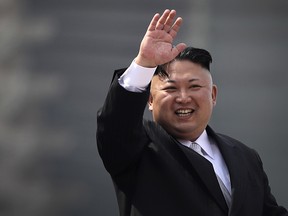 In this Saturday, April 15, 2017 photo, North Korean leader Kim Jong Un waves during a military parade in Pyongyang, North Korea, to celebrate the 105th birth anniversary of Kim Il Sung.