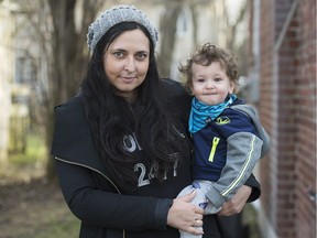 Marina Byezhanova holds her son Axel at their home in Hampstead, Montreal, Monday, April 24, 2017.