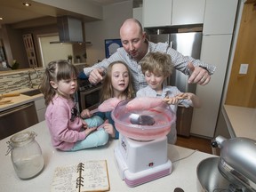 Royal York Hotel executive chef Robert Mills makes some fun food with his children Amelia, left, Eloise, and Eamon at home in Toronto.