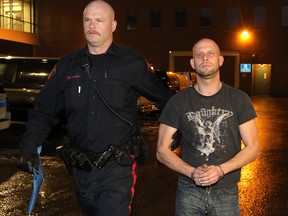 Allan Shyback is taken into custody in Calgary on December 6, 2014
