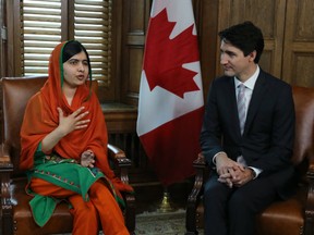 Malala Yousafzai speaks as she sits with Prime Minister Justin Trudeau in his Centre Block office during her visit to Parliament Hill for her Honorary Canadian Citizenship ceremony in Ottawa on April 12, 2017.