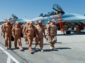 Russian Defence Minister Sergei Shoigu (C) visiting Russia's air base in Hmeimim, June 18, 2016