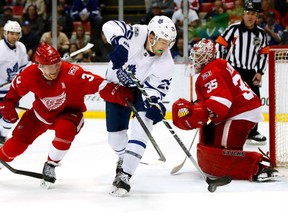 James van Riemsdyk of the Toronto Maple Leafs controls the puck just before scoring a third period goal against Red Wings netminder Jimmy Howard at Joe Louis Arena in Detroit on Saturday night.