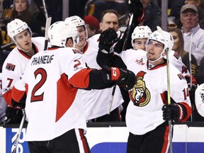 Alex Burrows of the Senators celebrates with teammate Dion Phaneuf after scoring against the Bruins in Boston during the second period of their game in Boston on April 6, 2017.