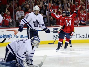 Toronto Maple Leafs goalie Frederik Andersen and Auston Matthews are downcast as Justin Williams of the celebrates his game winning goal in overtime to give the Capitals 2-1 win in Game 5 of their Eastern Conference first-round series at Verizon Center in Washington on Friday night.
