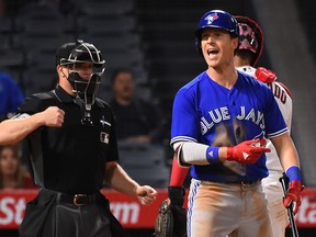 Chris Coghlan of the Toronto Blue Jays reacts after called out on a checked swing by umpire Toby Basner in the ninth inning of the game against the Los Angeles Angels at Angel Stadium of Anaheim on April 24, 2017 in Anaheim, California.