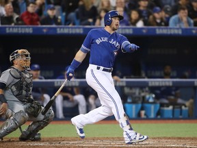Justin Smoak of the Toronto Blue Jays hits a single in the fourth inning against the Tampa Bay Rays at Rogers Centre on April 29, 2017.
