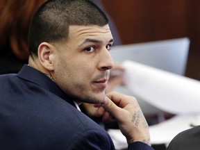 In this March 15, 2017, file photo, Aaron Hernandez listens during his double murder trial in Suffolk Superior Court in Boston.