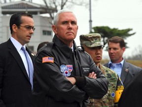 Mike Pence (C) visits the truce village of Panmunjom in the Demilitarized Zone (DMZ) on the border between North and South Korea on April 17, 2017