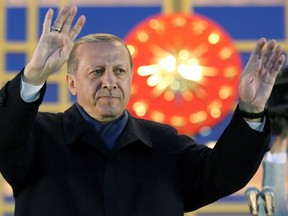 Turkish president Recep Tayyip Erdogan acknowledges supporters following the results in a nationwide referendum