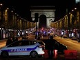 Police officers block the access to the Champs Elysees in Paris after a shooting on April 20, 2017.