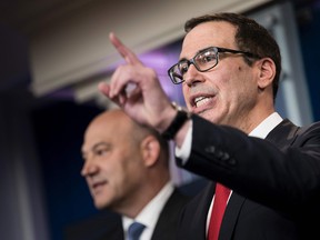 National Economic Council Director Gary Cohn(L) and U.S .Secretary of the Treasury Steven Mnuchin take questions about tax cuts and reform during a briefing at the White House April 26, 2017