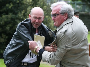 Canadian ambassador Kevin Vickers, right, grabs a protester at an event in Dublin last year. He said in emails at the time, just released, that he feared losing his job over the incident.