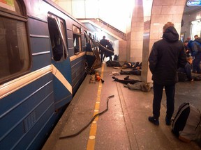Blast victims lie near a subway train hit by a explosion at the Tekhnologichesky Institut subway station in St.Petersburg, Russia, Monday, April 3, 2017