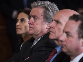 From left, White House senior counselor Dina Powell, chief strategist Stephen Bannon, national security adviser H.R. McMaster and Chief of Staff Reince Priebus at President Donald Trump's news conference Wednesday.