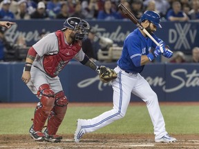 Toronto Blue Jays' Jose Bautista strikes out and is tagged by Boston Red Sox catcher Sandy Leon in the eighth inning of their American Leguae baseball game at the Rogers Centre on Thursday, April 20, 2017.