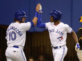 Toronto Blue Jays' Melvin Upton Jr. (centre) celebrates his two-run home run with teammate Jared Saltalamacchia during the fourth inning of the Blue Jays' final exhibition game in Montreal on Saturday, April 1, 2017.