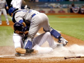 Catcher Russell Martin blocks the plate as he tags out Tampa Bay Rays' Steven Souza Jr. on a play at the plate during MLB action Thursday in Tampa. The Jays were 5-2 winners.