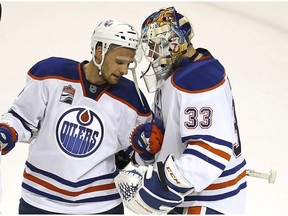 Edmonton Oilers defenseman Andrej Sekera (2) celebrates with Edmonton Oilers goalie Cam Talbot (33) after a 3-1 victory against the San Jose Sharks in Game 6 of a first-round NHL hockey playoff series Saturday, April 22, 2017, in San Jose, California. Edmonton Oilers won the series 4-2.