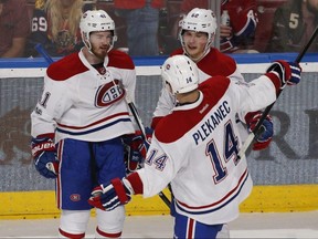 Montreal Canadiens forward Artturi Lehkonen (centre) is congratulated by Paul Byron (left) and Tomas Plekanec after scoring against the Florida Panthers on April 3.