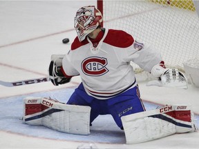 Montreal Canadiens goalie Carey Price deflects the puck into the corner against the Buffalo Sabres on April 5.