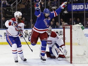 Rick Nash of the Rangers celebrates after scoring a goal as Montreal Canadiens' Jordie Benn, left, and goalie Carey Price watch during the second period of Game 4 of their first-round playoff series Tuesday night in New York.