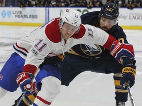 Montreal Canadiens forward Brendan Gallagher skates past Sabres defenceman Zach Bogosian during the second period of their game Wednesday night  in Buffalo.