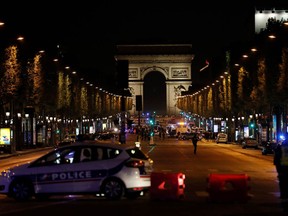 Police officers block the access to the Champs Elysees in Paris after a shooting on April 20, 2017.