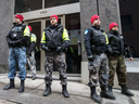 Montreal police officers have been dressing in camouflage pants and red caps to protest against proposed pension fund changes.
