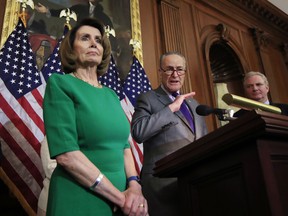 Senate Minority Leader Charles Schumer of N.Y., with House Minority Leader Nancy Pelosi of Calif. and Sen. Chris Van Hollen, D-Md., speak to reporters about President Donald Trump's first 100 days, during a news conference on Capitol Hill in Washington, Friday, April 28, 2017