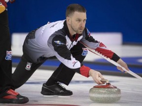 Canada skip Brad Gushue throws a rock against China on April 4.