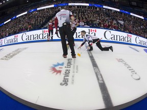 Team Canada skip Brad Gushue makes a shot during a draw against Switzerland at the world men's curling championship in Edmonton on Saturday.